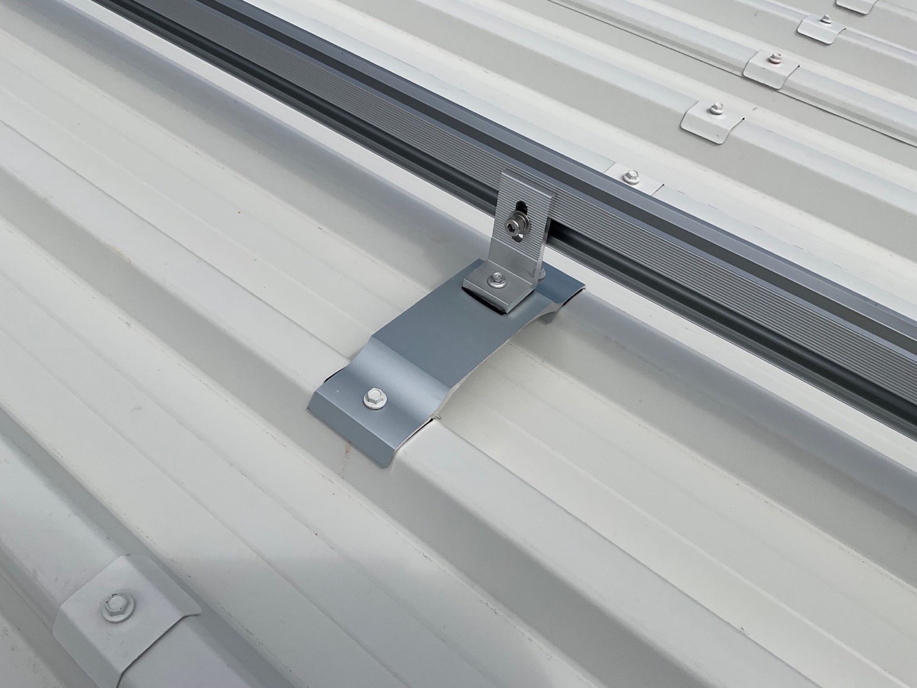 RoofLogic Helios bracket fixed to a trough profile roof