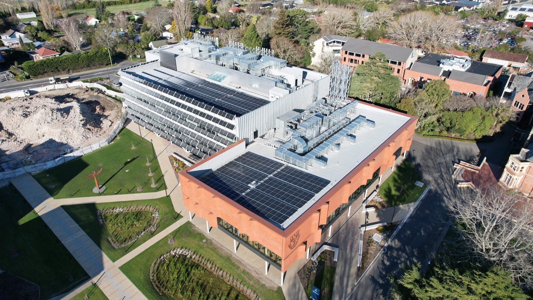 Aerial view of an AgResearch building with rooftop solar panels and plant equipment