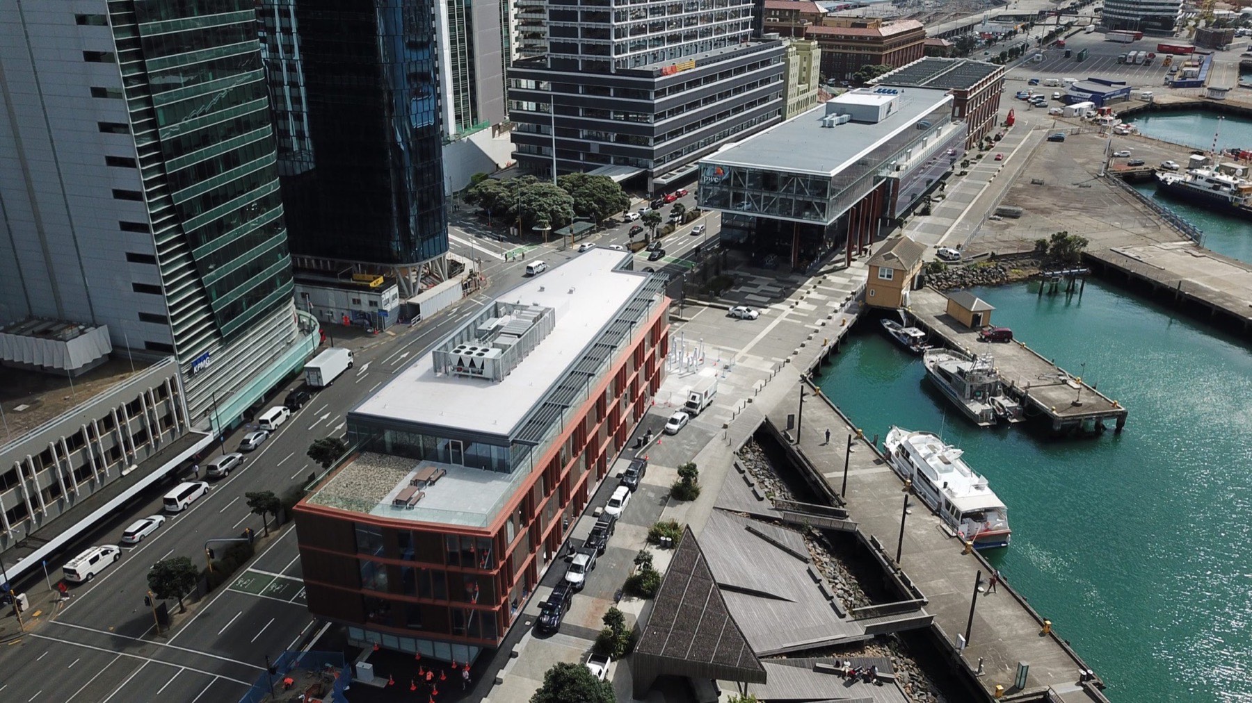 Aerial view of Bell Gully and PwC buildings on Wellington's waterfront with membrane roofs